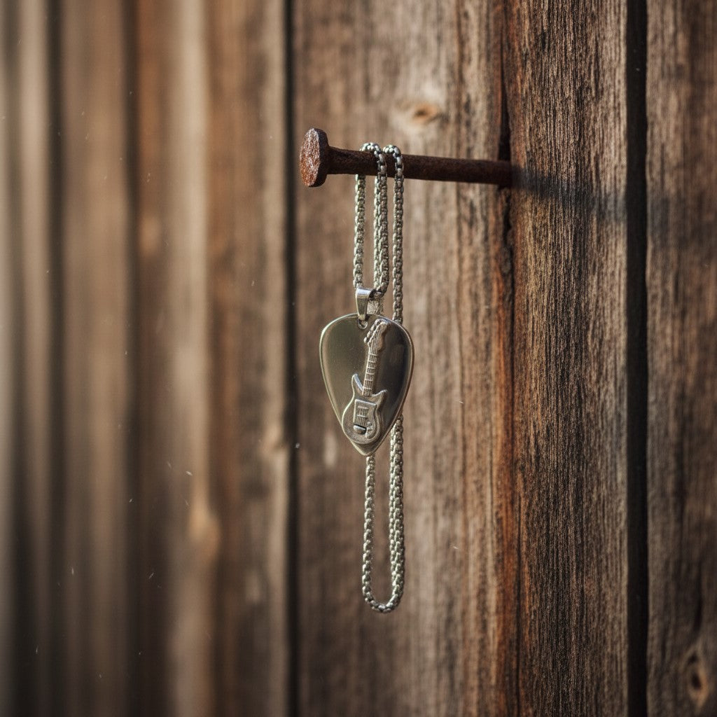 Stainless steel guitar pick necklace on the  wall, rusty nail in the rustic barn