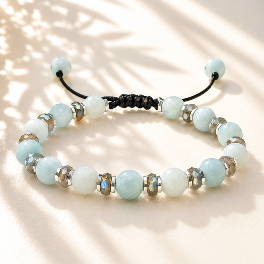 Handmade adjustable Amazonite, Labradorite, and Hematite gemstone bracelet for women featuring natural light blue Amazonite beads, shimmering faceted Labradorite spacers with iridescent flash, and polished Hematite accents. Waterproof adjustable cord bracelet for everyday wear, yoga, meditation, healing crystal jewelry, birthday gift, anniversary gift, Mother's Day gift, and boho minimalist fashion accessory.
