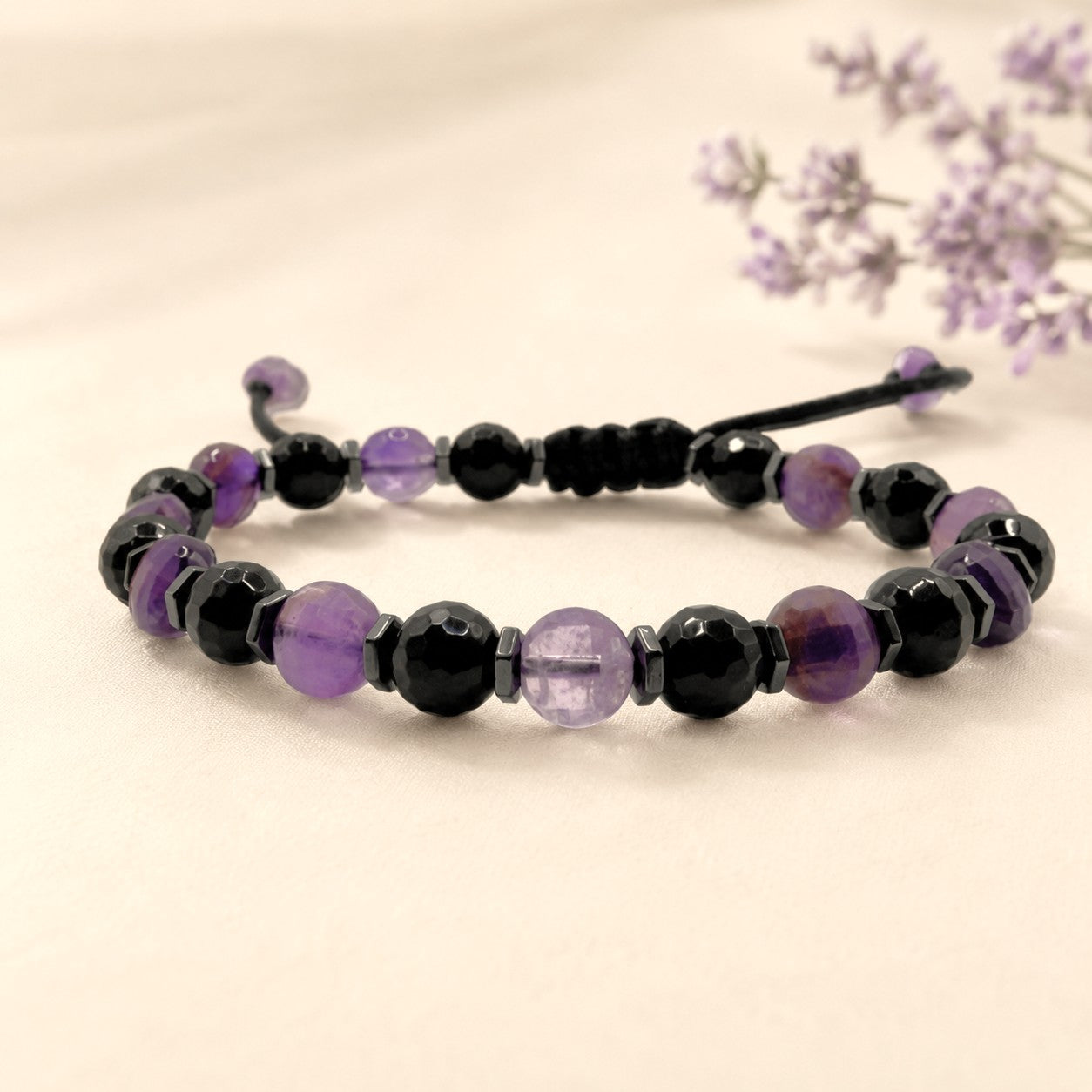 Personalized Amethyst and Black Onyx Bracelet with Hematite Accents, Adjustable Waterproof Gemstone Bracelet for Women, Handmade Purple Amethyst Crystal Jewelry with Black Onyx Beads and Optional Initial Charm. This elegant beaded bracelet features genuine faceted amethyst gemstones, polished black onyx stones, and hematite spacer beads on a durable adjustable black cord. Lightweight, comfortable, and waterproof for everyday wear, this handmade bracelet makes a meaningful birthday gift for any woman.