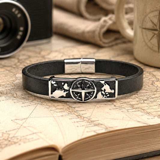 Black leather  with stainless steel compass charm and magnetic clasp bracelet . This handcrafted travel-inspired bracelet features a stainless steel compass centerpiece with world map detailing, genuine black leather band, and secure magnetic clasp. Shown in a nautical adventure setting, this minimalist bracelet symbolizes exploration, direction, and wanderlust. Perfect gift for travelers, sailors, adventurers, husbands, boyfriends, fathers, and anyone who loves the ocean, boating, and traveling.