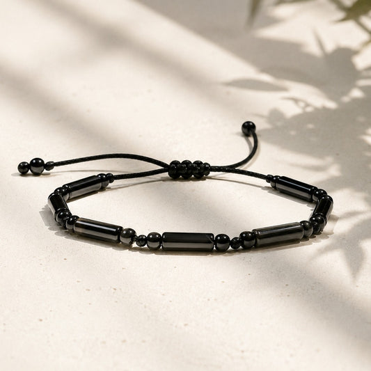Adjustable black onyx bracelet with tube and round gemstone beads on waterproof black cord, minimalist protection jewelry