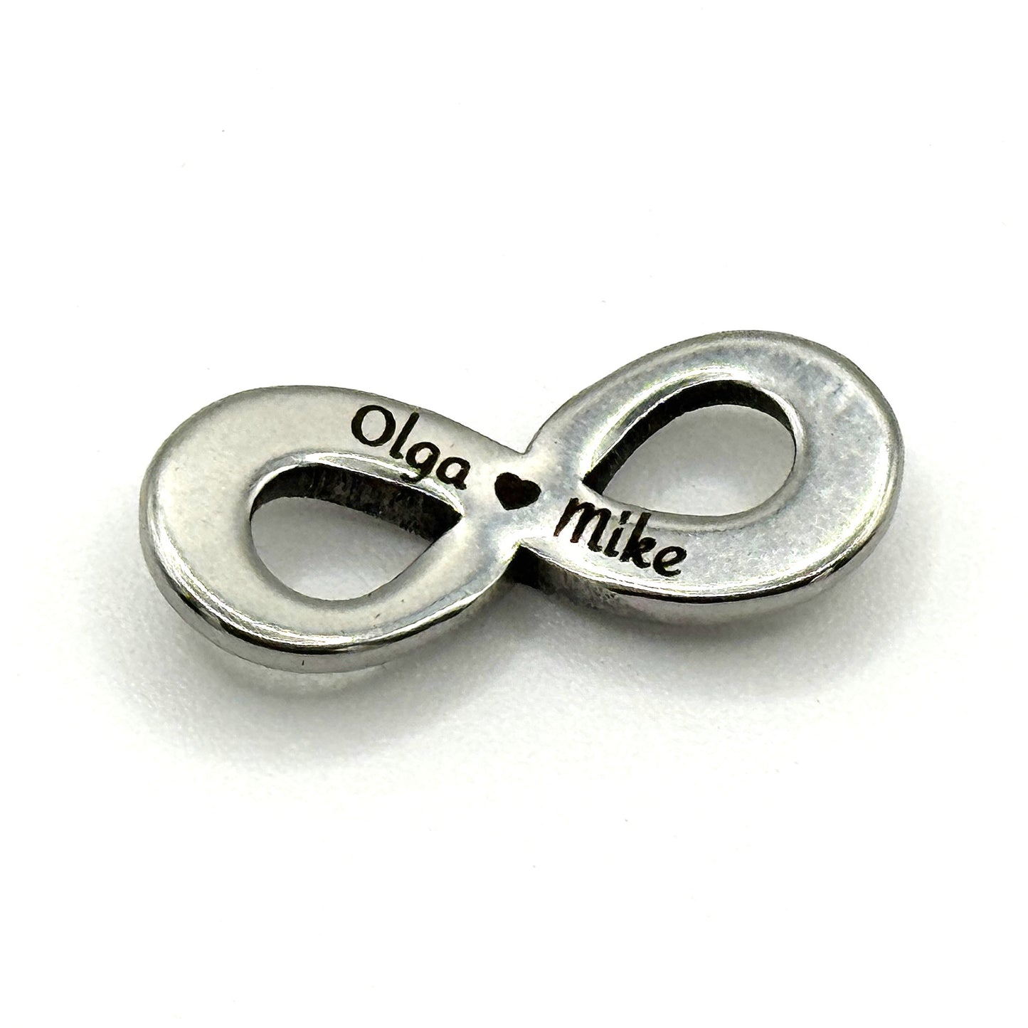 Adjustable leather Bracelet with a stainless steel infinity symbol with a hidden engraved Olga love Mike.