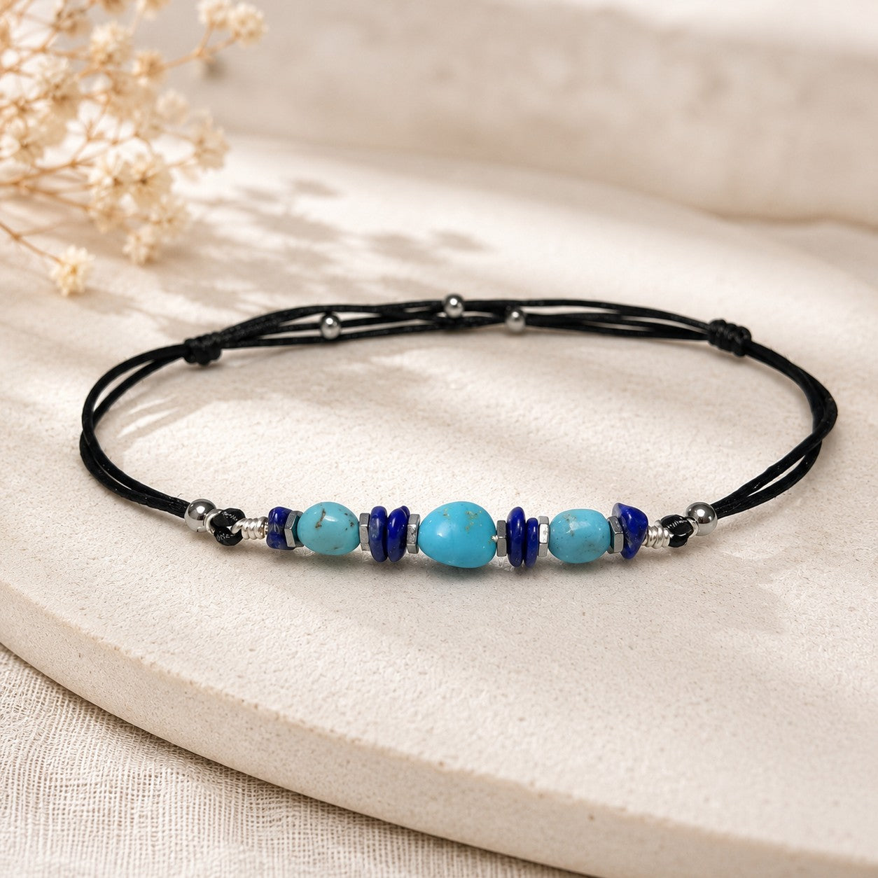 Handcrafted anklet with polished gemstones, including turquoise, lapis lazuli, and hematite, each offering unique textures under your fingertips. The anklet is lightweight and designed to be comfortable and waterproof for everyday wear.