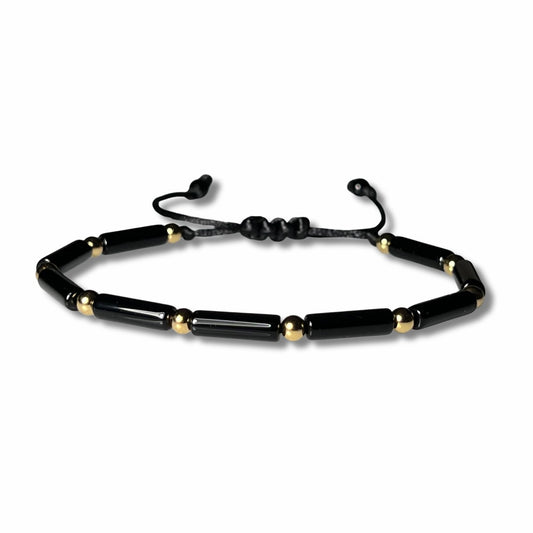 Adjustable and waterproof Black onyx beaded bracelet with gold accent beads  on a white background