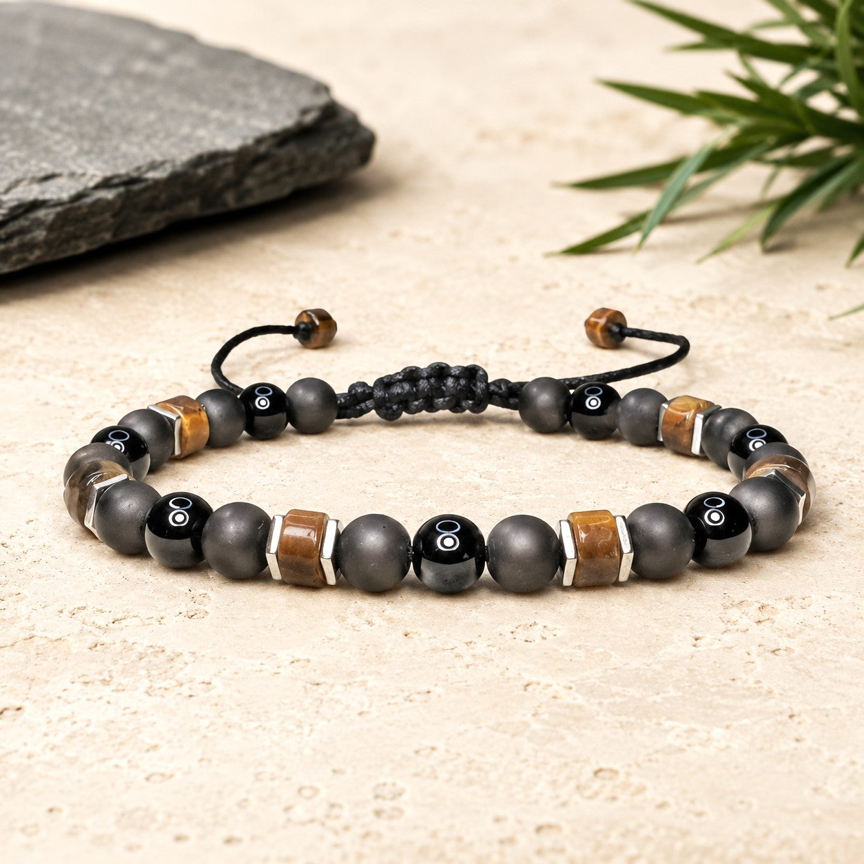 Black Tourmaline with Tiger Eye bracelet is easily adjustable and waterproof. Great for both men and women. 6mm round Black gemstones embellished with Heishi Coin Disc Tiger Eye beads and square silver Hematite beads. Personalized with one initial.