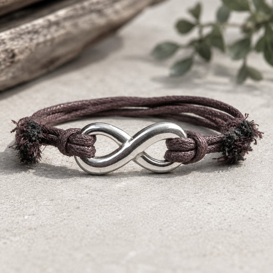 Cotton Cord Adjustable bracelet with Stainless Steel Infinity Charm. Featuring an infinity charm on cotton sliding knots for easy adjustable sizing. Handmade, waterproof. Choose between black or brown cotton cord, Silver or Gold Infinity.