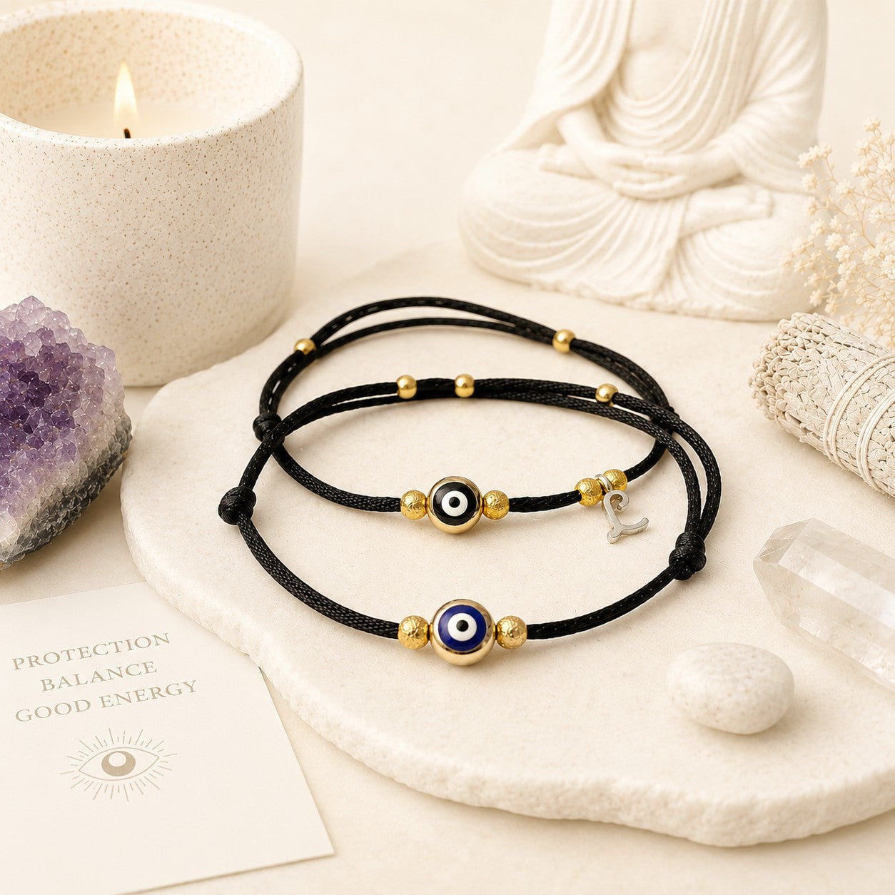 Matching evil eye anklets for couples featuring delicate black adjustable cords accented with deep blue and black protective evil eye charms, framed by petite gold-tone beads. Designed as a meaningful anniversary gift for husband and wife, these minimalist anklets symbolize love, connection, protection, and good fortune. Lightweight and comfortable for everyday wear, the coordinating set creates a subtle yet stylish reminder of a special bond. The adjustable design ensures a comfortable fit.