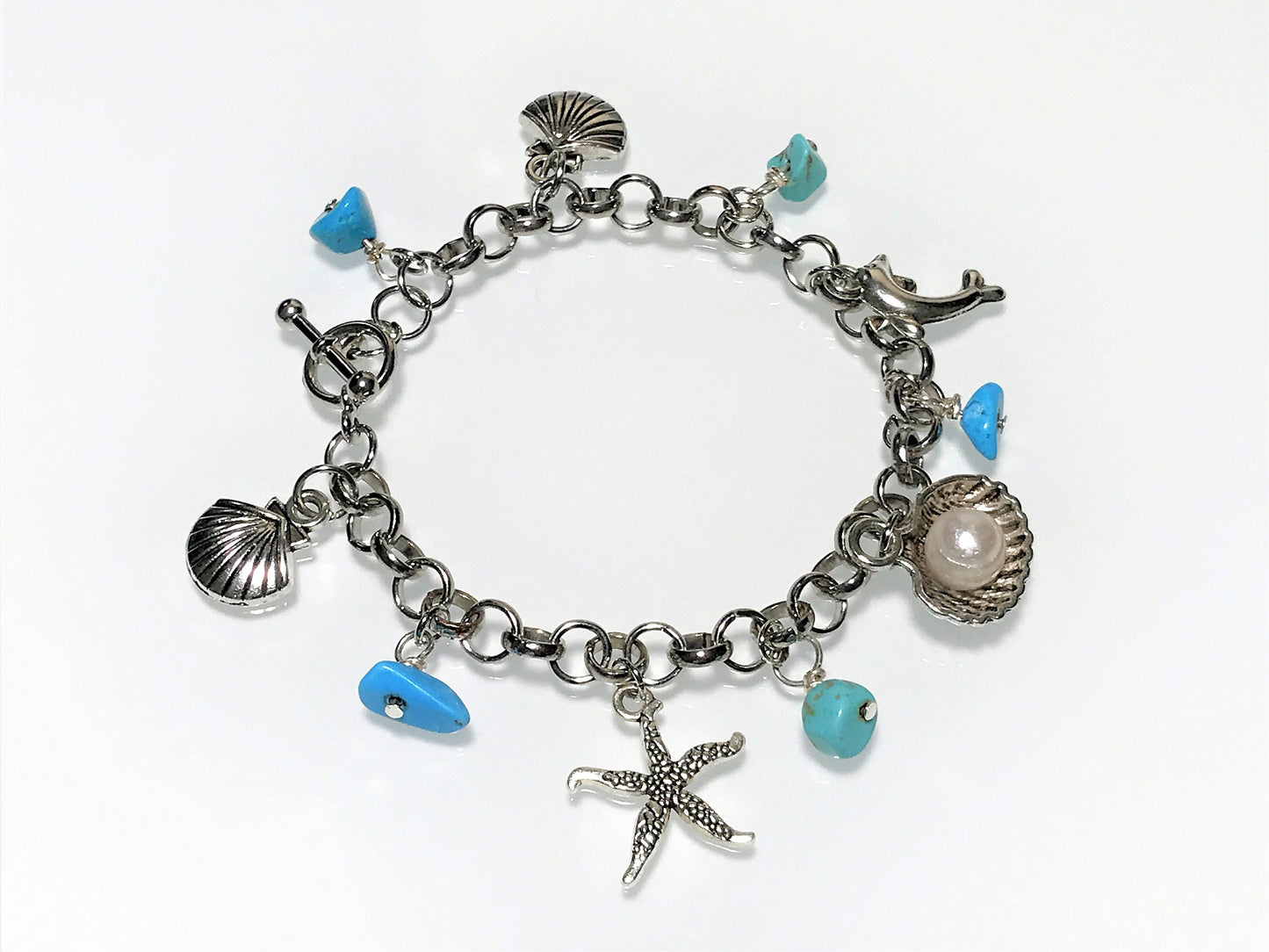 Turquoise Charm Bracelet: Pearl, Shell, Dolphin - Personalized Initial - on model