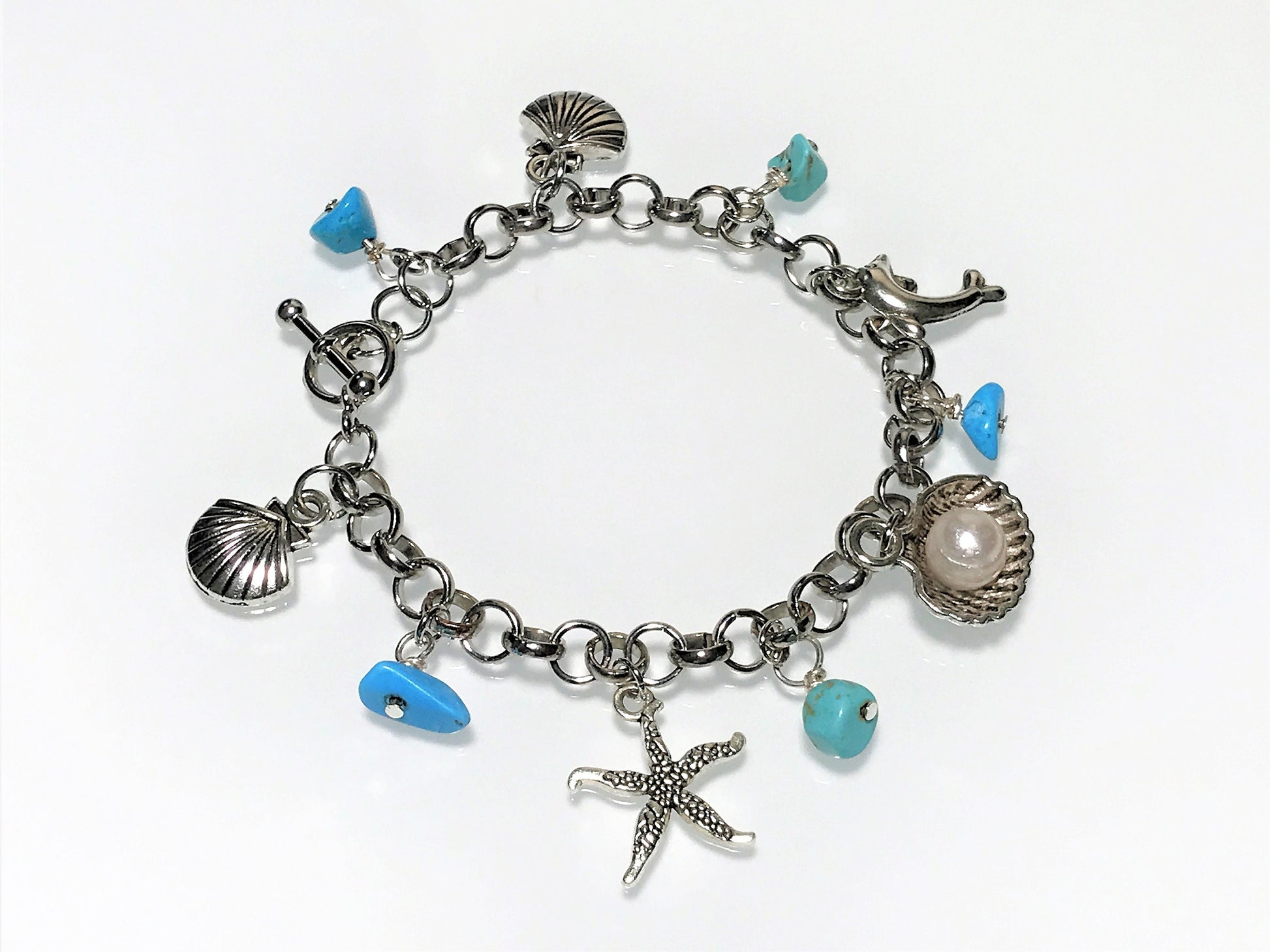 Turquoise Charm Bracelet: Pearl, Shell, Dolphin - Personalized Initial - on model