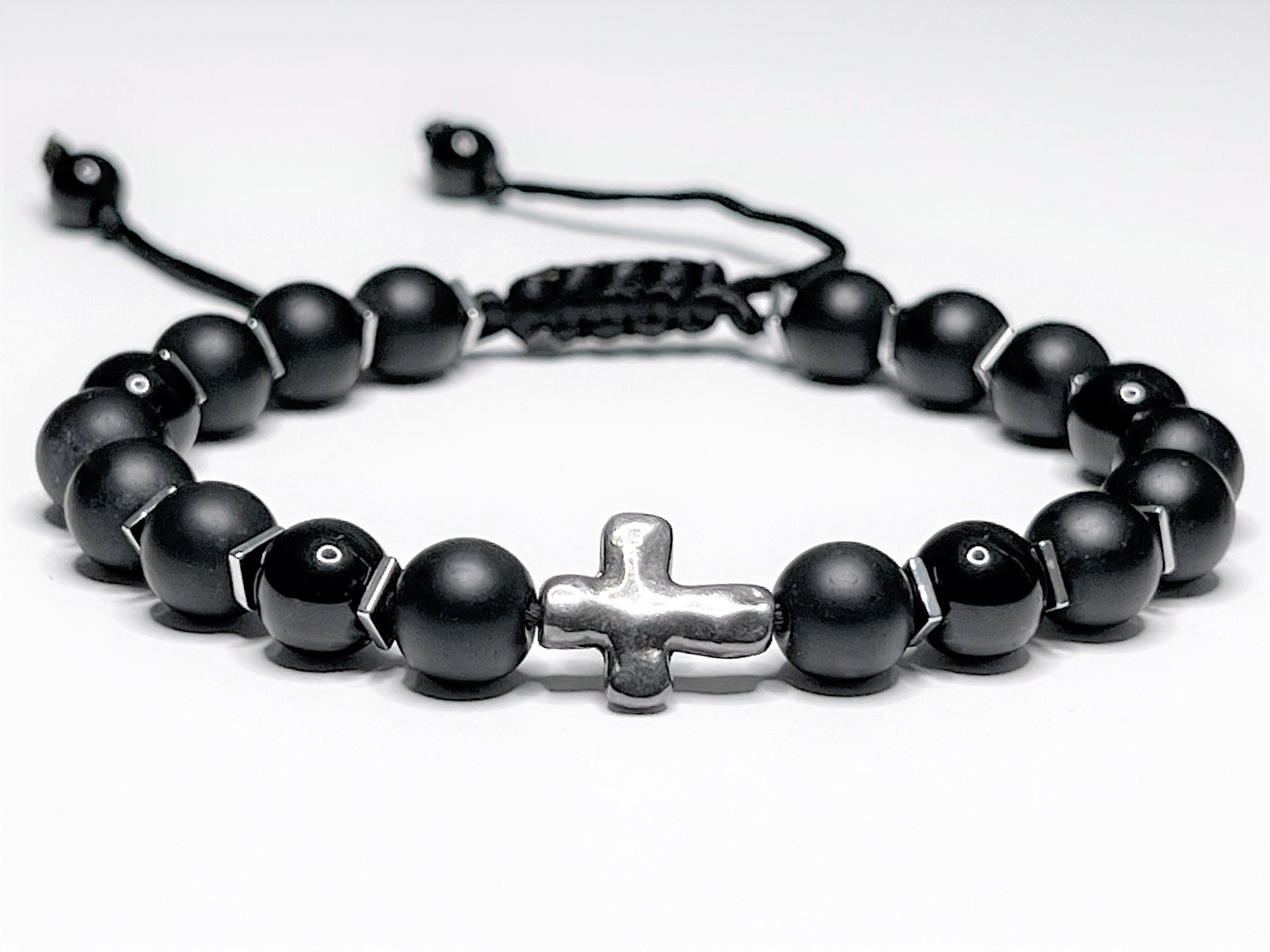 Matte Black Onyx Christian beaded bracelet with 8mm beads. Bracelet made with a mix of matte and shiny beads for contrast. In a middle of a bracelet sideways cross. Bracelet is adjustable.