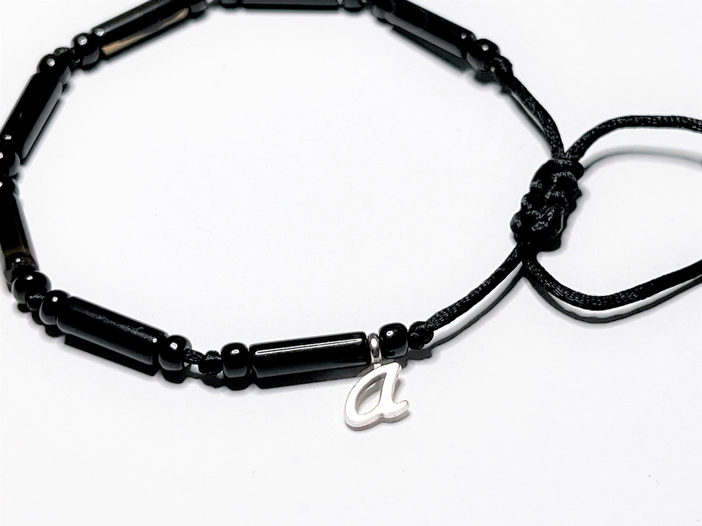 Black Onyx Bracelet can be a Personalized bracelet with one initial letter charm. Showing personalization with the letter"a." Choose from A to Z.