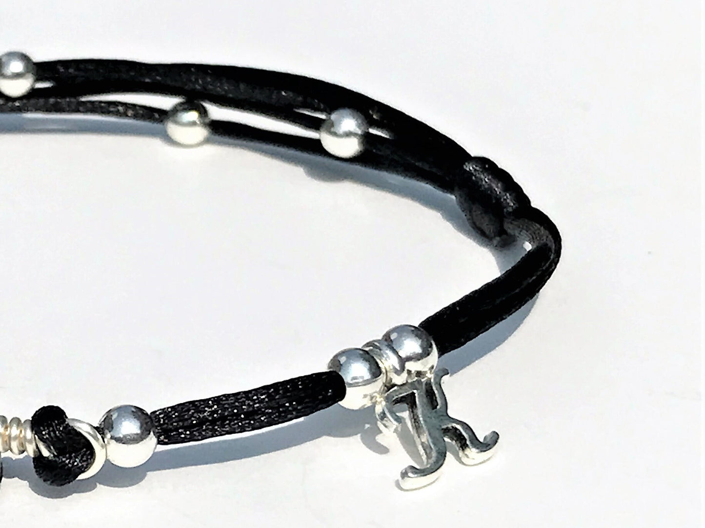 Garnet Anklet with personalization. An initial letter charm was added to the string.