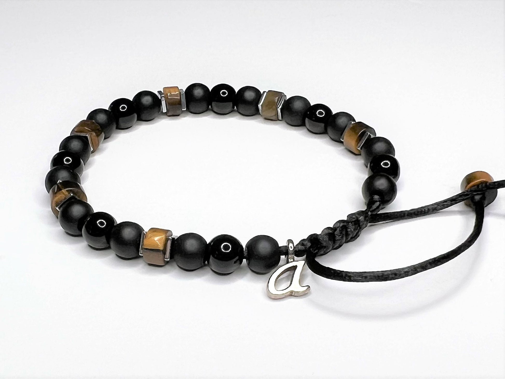 Initial charm added to the bracelet. The initial letter A is next to the clasp.