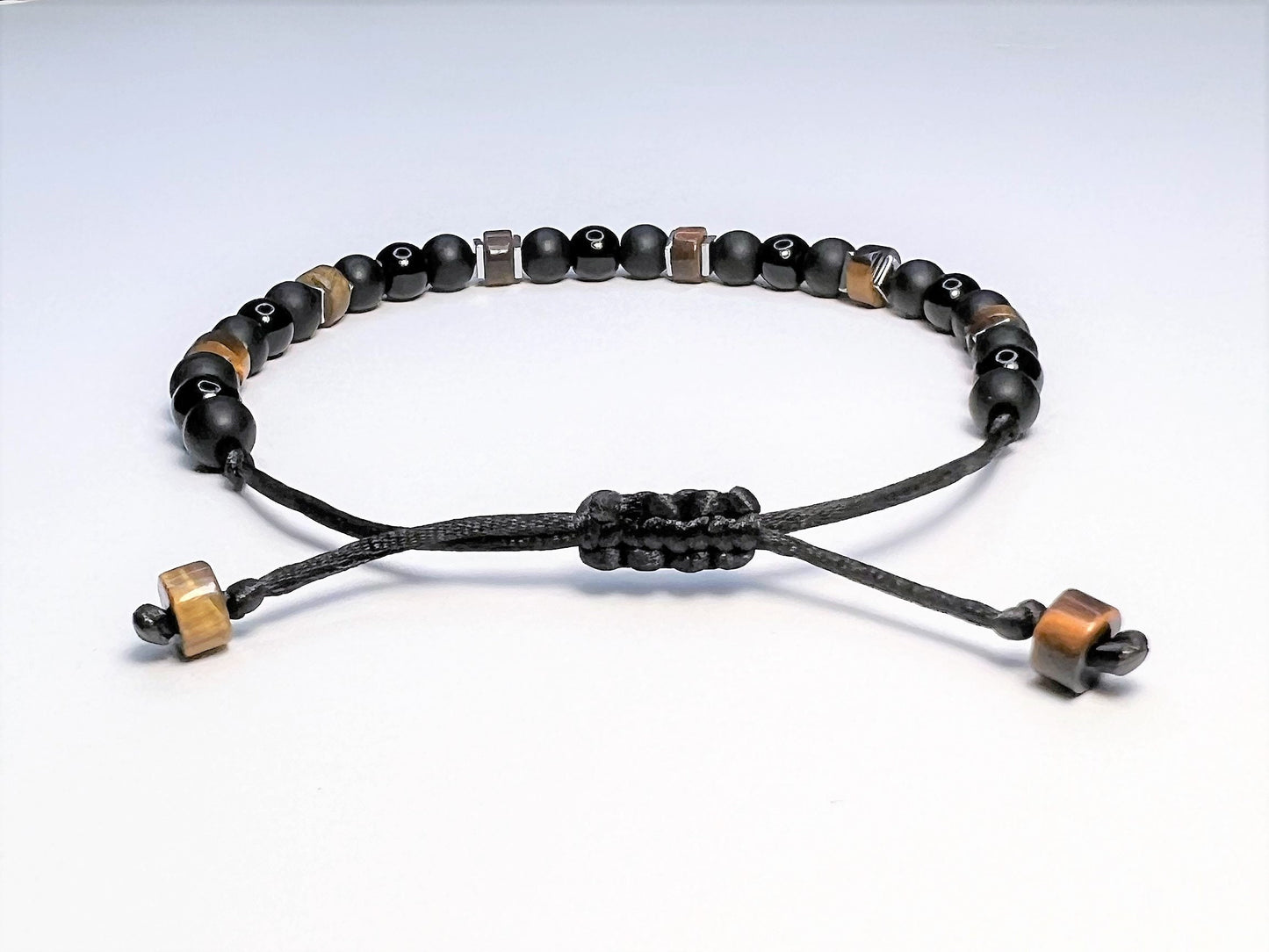 Macrame sliding clasp. Adjustable from 6 to 9 inches for regular adult size or 8 to 12 for adult plus size.