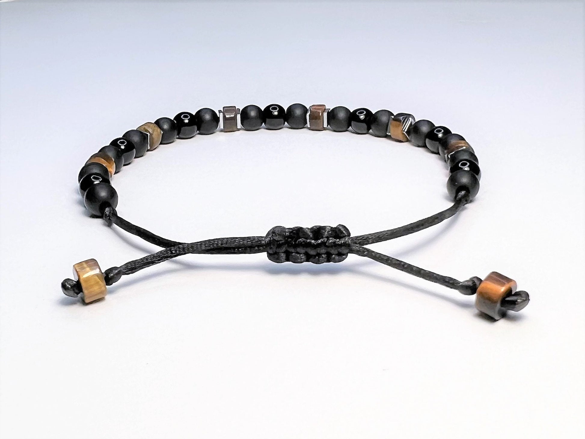 Macrame sliding clasp. Adjustable from 6 to 9 inches for regular adult size or 8 to 12 for adult plus size.