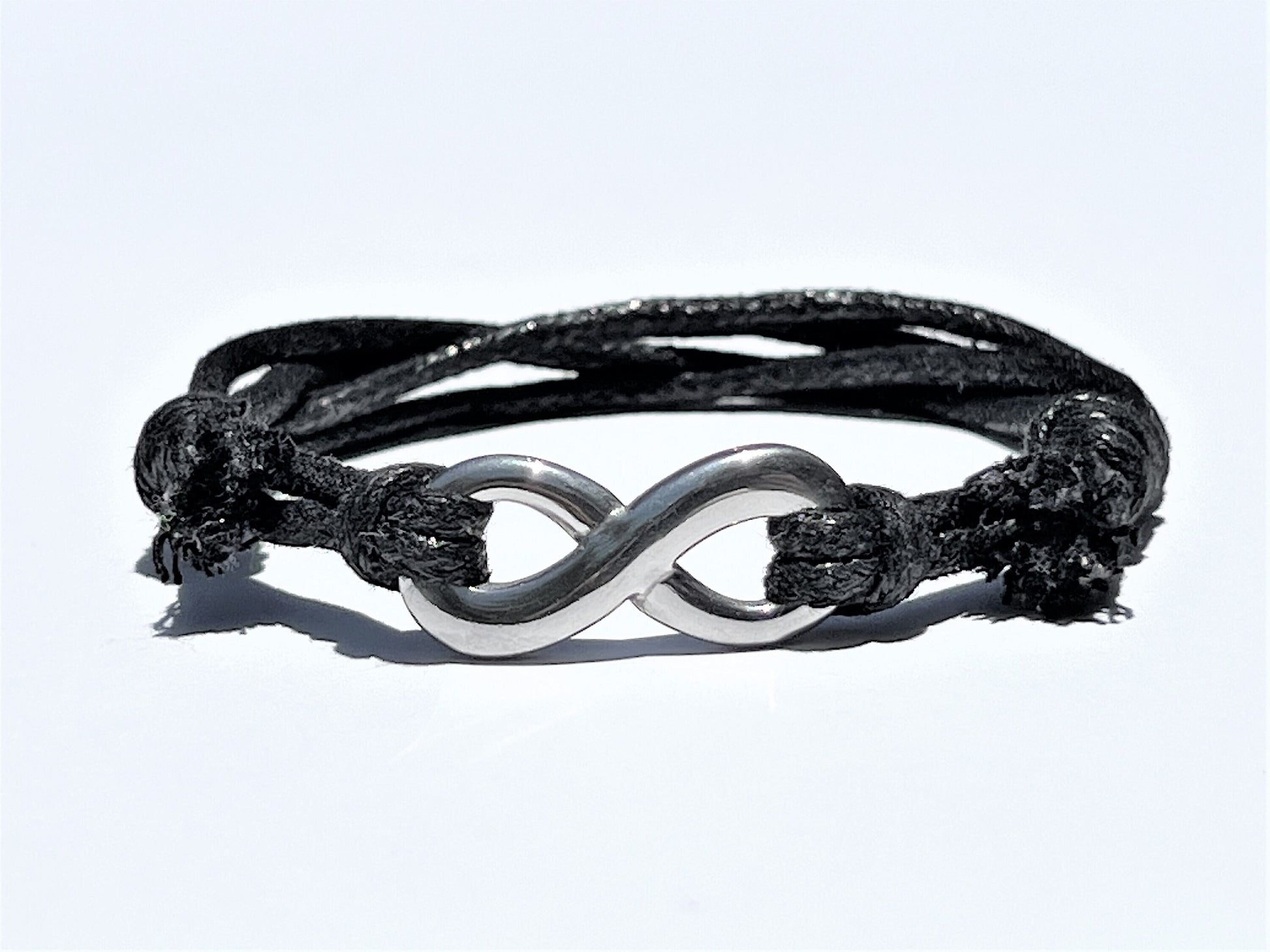 Cotton Cord Infinity Bracelet: Stainless Steel, Adjustable Knot - lifestyle photo