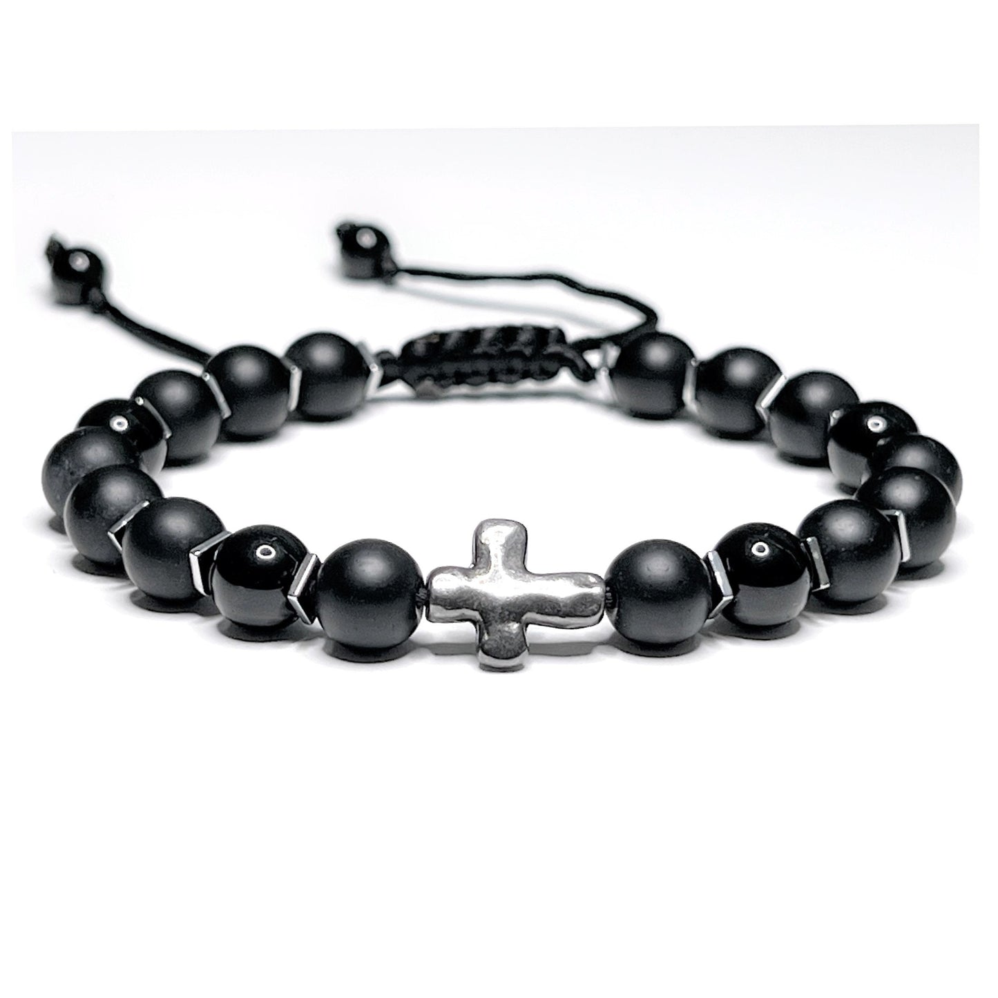 Adjustable black onyx beaded bracelet with silver hematite spacers and a central silver cross on a macramé nylon cord.