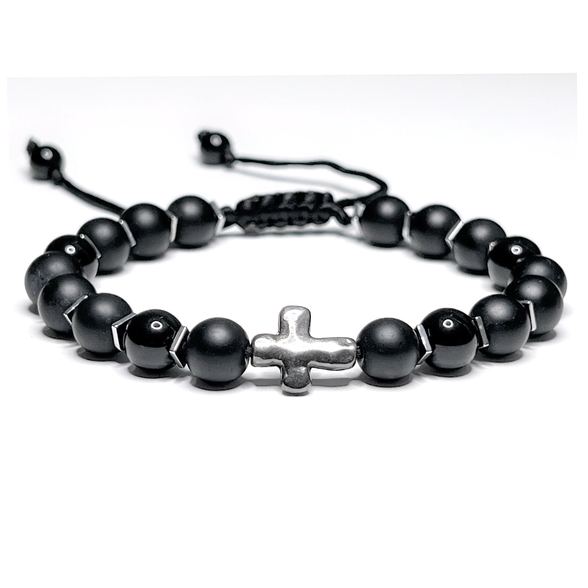 Adjustable black onyx beaded bracelet with silver hematite spacers and a central silver cross on a macramé nylon cord.