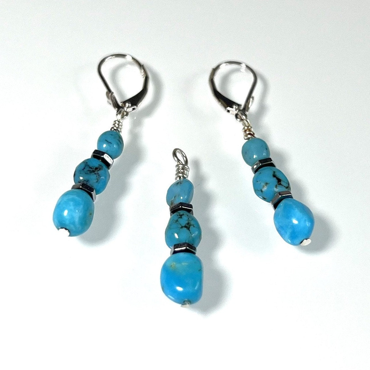 Discover our Sleeping Beauty Natural Arizona Turquoise Jewelry Set. Includes earrings and a pendant with untreated turquoise nuggets accented by hematite beads in sterling silver—the perfect gift for women, crafted and shipped from Austin, Texas.