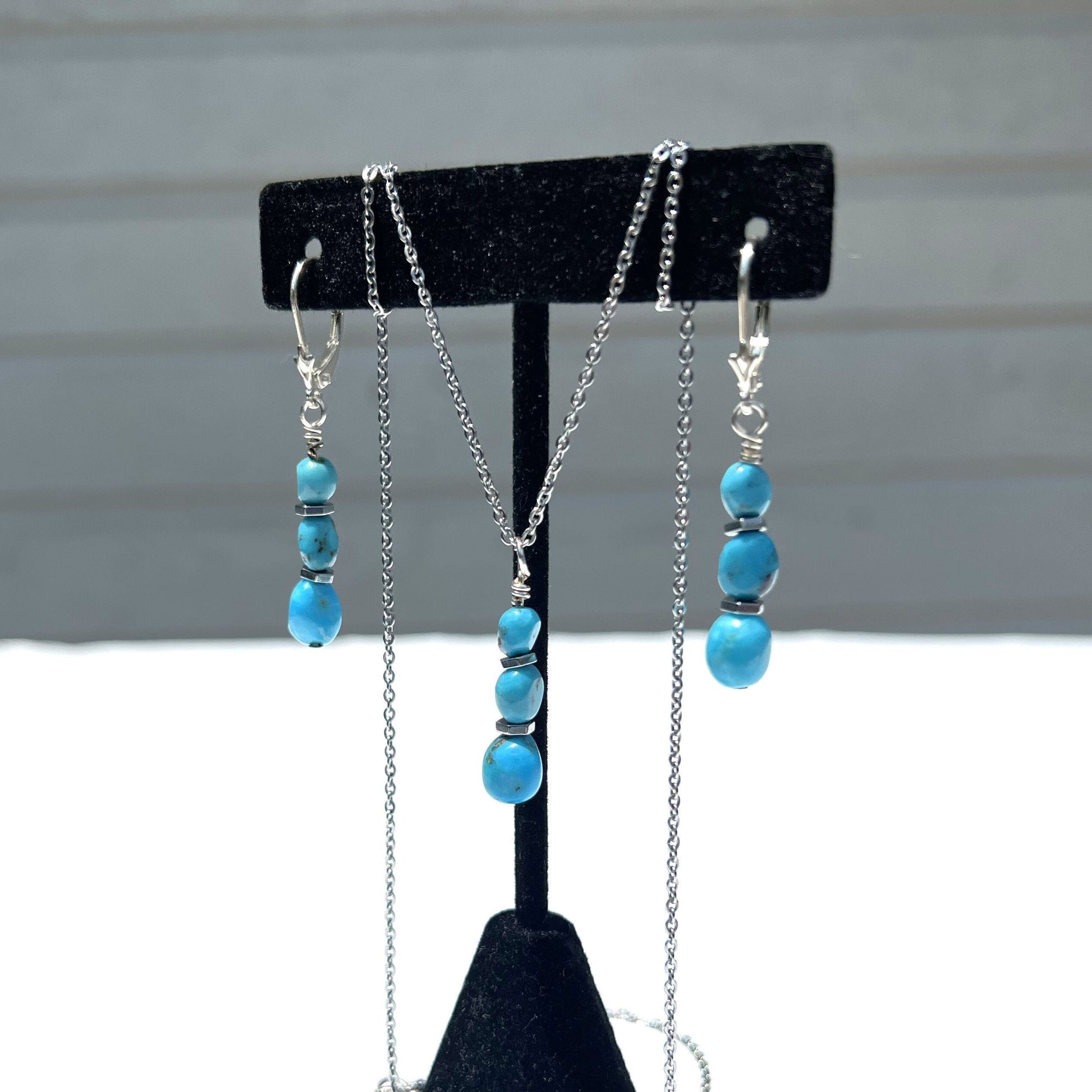 Discover our Sleeping Beauty Natural Arizona Turquoise Jewelry Set. Includes earrings and a pendant with untreated turquoise nuggets accented by hematite beads in sterling silver—the perfect gift for women, crafted and shipped from Austin, Texas.