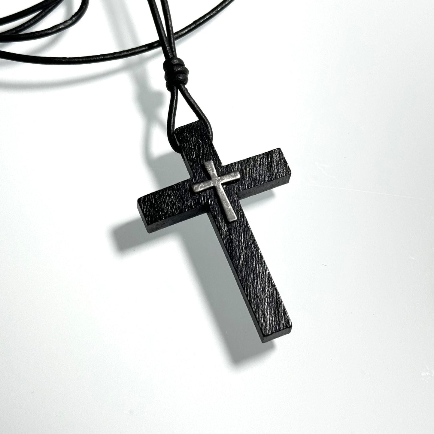 Black wooden or brown wooden cross necklace on a leather cord. Adjustable between 16 and 26 inches. Great gift for men, women, or children. It can be personalized with gemstone or initial.