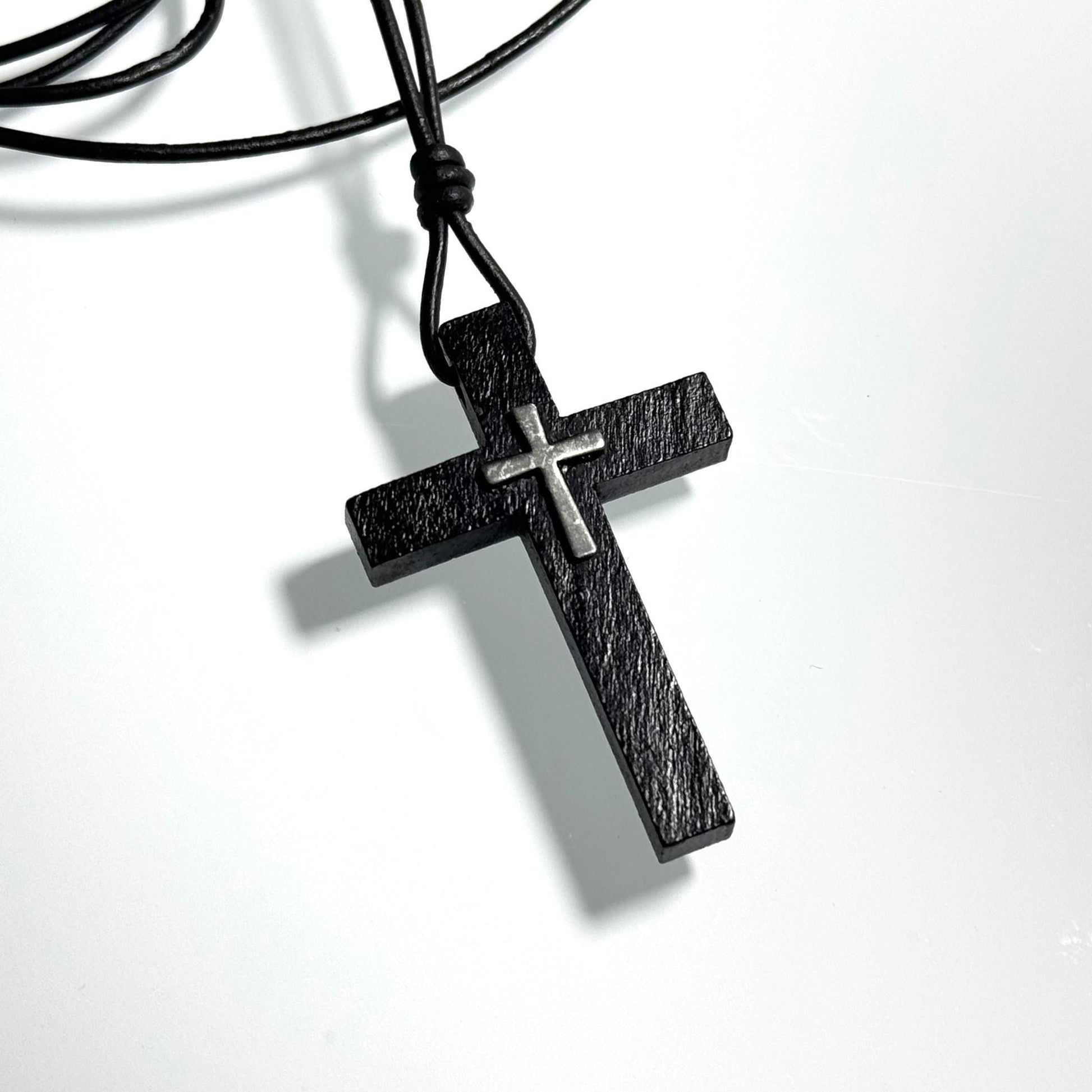 Black wooden or brown wooden cross necklace on a leather cord. Adjustable between 16 and 26 inches. Great gift for men, women, or children. It can be personalized with gemstone or initial.