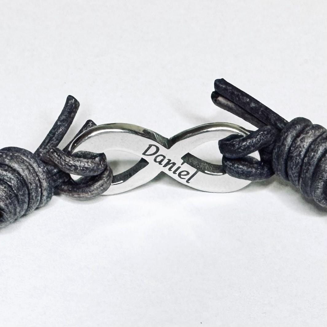 Adjustable leather Bracelet with a stainless steel infinity symbol with a hidden  engraved name  