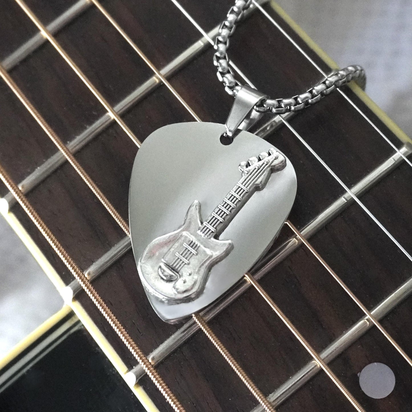 Custom Stainless Steel Guitar Pick Necklace on electric guitar.