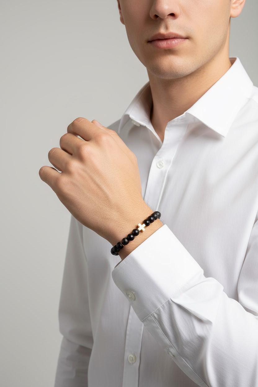 black Onyx bracelet with a white gold-filled cross centerpiece.  The Cross can be personalized with Custom Engravings, including a man wearing a bracelet on his wrist. 