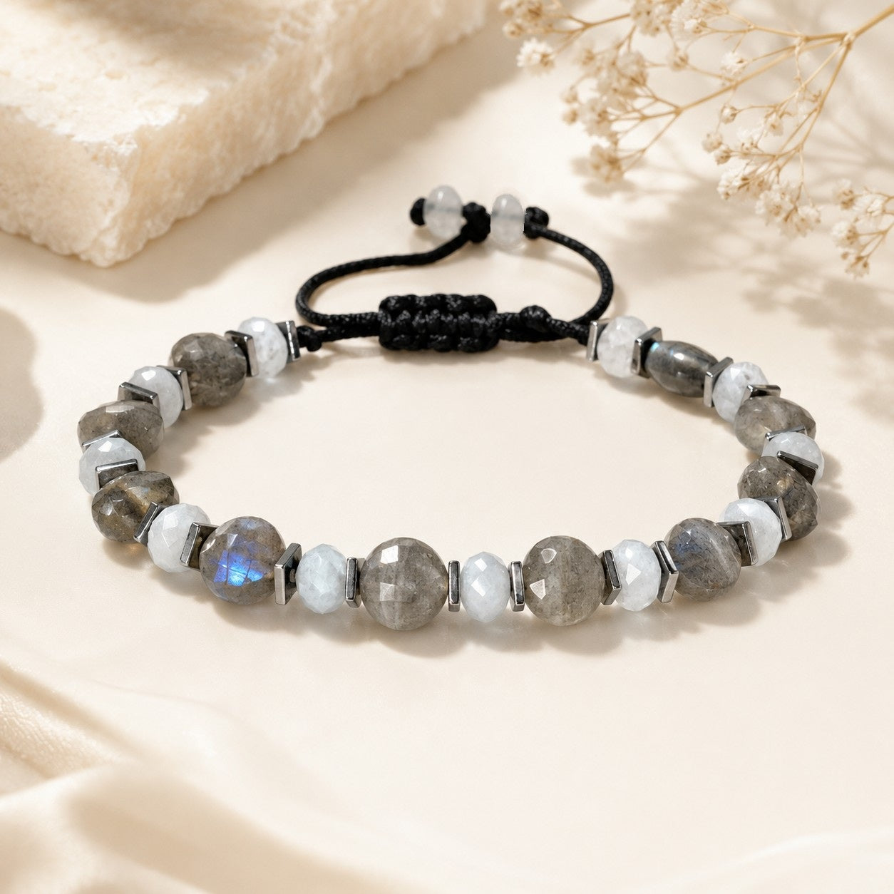 Adjustable Labradorite, Aquamarine, and Hematite bracelet with faceted gray Labradorite gemstones, smaller round light-blue Aquamarine beads, silver-tone Hematite accents, waterproof black cord, and adjustable sliding closure. Elegant handmade gemstone bracelet for women, everyday wear, gift, beach jewelry, and minimalist style.