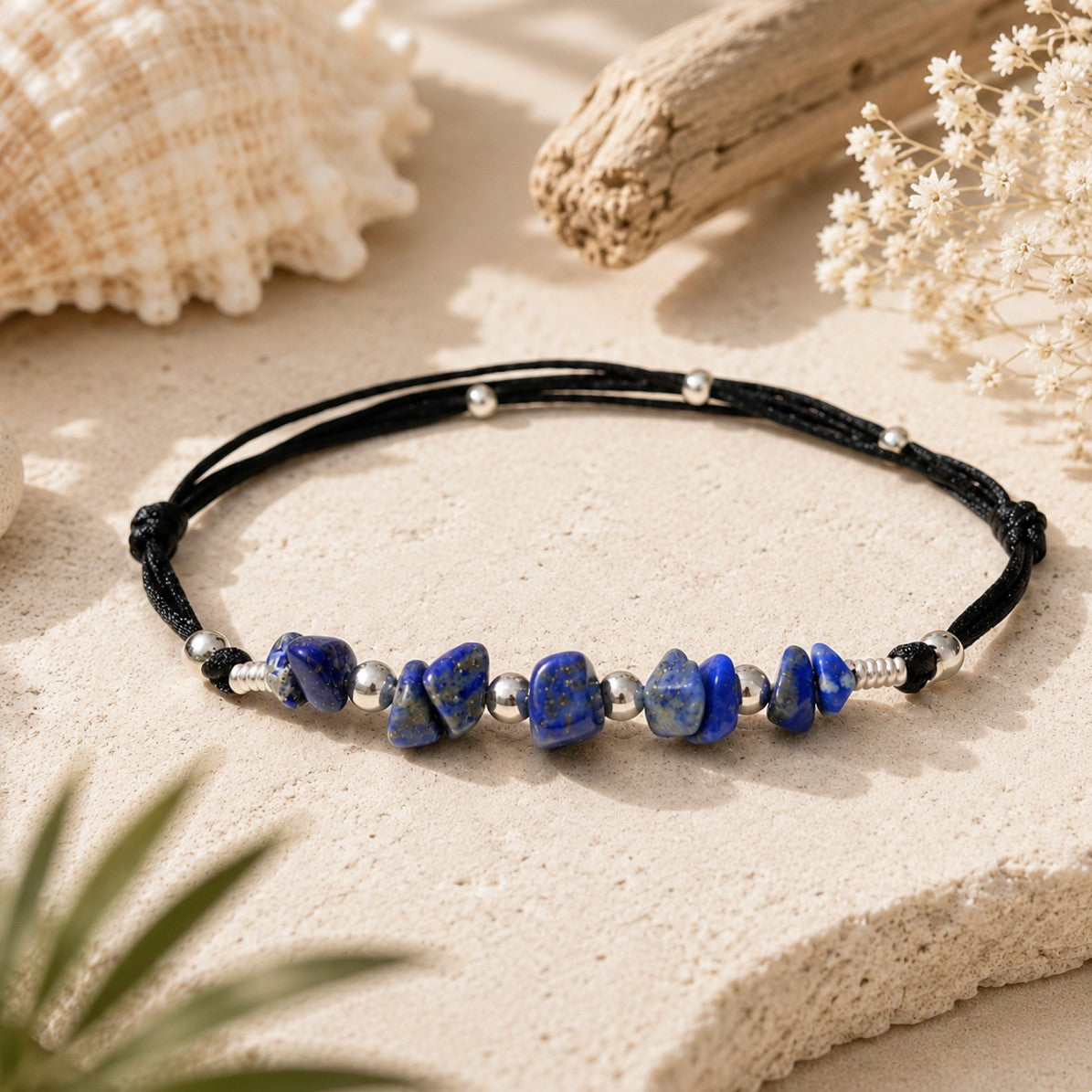 Waterproof Lapis Lazuli anklet/bracelet on a silky nylon cord, accented with small silver beads. To make it unique, personalize it with an initial charm. Lapis Lazuli promotes mental balance and wards off negative energy. Custom sizes are available.