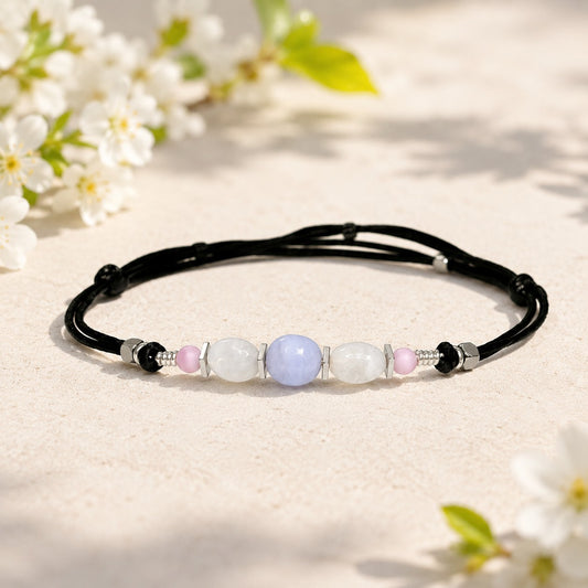 Moonstone and Blue Lace Agate gemstones anklet. The anklet is made with silky black string and adjustable for a perfect size.  
One Blue Lace Agate surrounds smaller moonstone gemstones. In between gemstones are square flat Hematite silver beads.