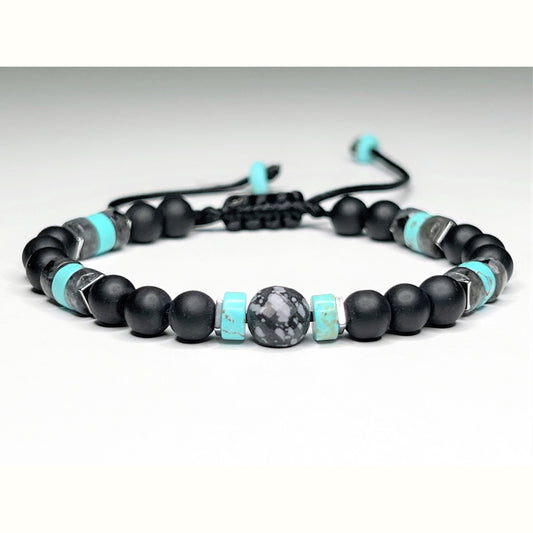 Matte Black Onyx with Labradorite, Turquoise, and Hematite Protection Bracelet for Men and Women. The bracelet is easily adjustable with a sliding clasp. Beads are 6mm round mate Black Onyx with accent Turquoise heishi beads and square Hematite.