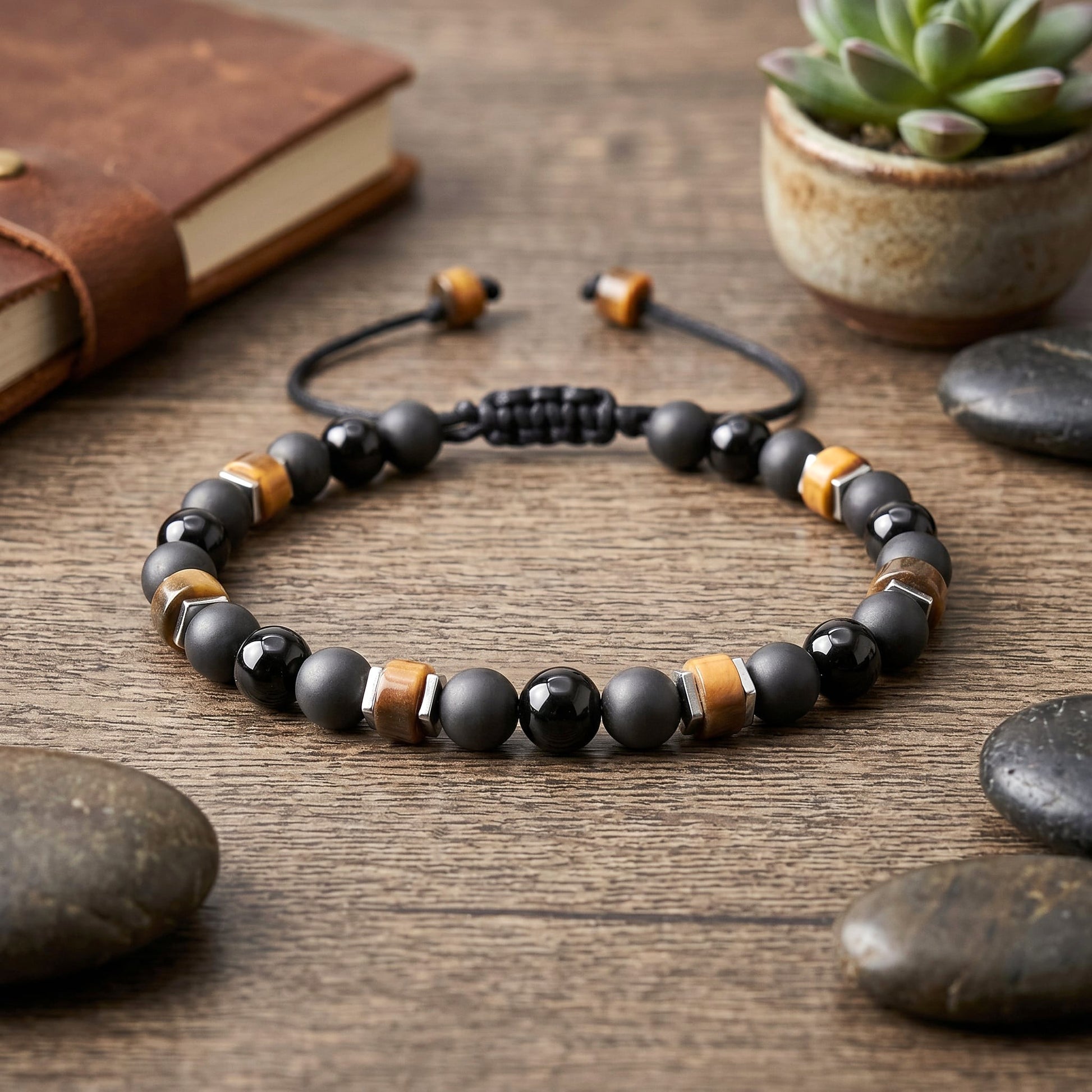 Black Tourmaline with Tiger Eye bracelet is easily adjustable and waterproof. Great for both men and women. 6mm round Black gemstones embellished with Heishi Tiger Eye beads and square silver Hematite beads. Personalized with one initial.