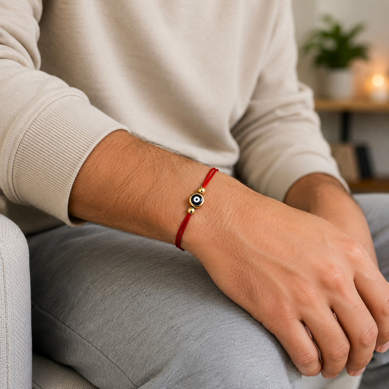 Red evil eye bracelet, featuring a minimalist adjustable red cord design with a protective black-and-white evil eye charm and gold-tone accent beads. The handmade waterproof bracelet highlights its modern, unisex look. Symbolizing protection, luck, and positive energy, this lightweight friendship bracelet is perfect for everyday wear, stacking, gifting, meditation, spiritual jewelry collections, birthdays, anniversaries, and meaningful gifts.