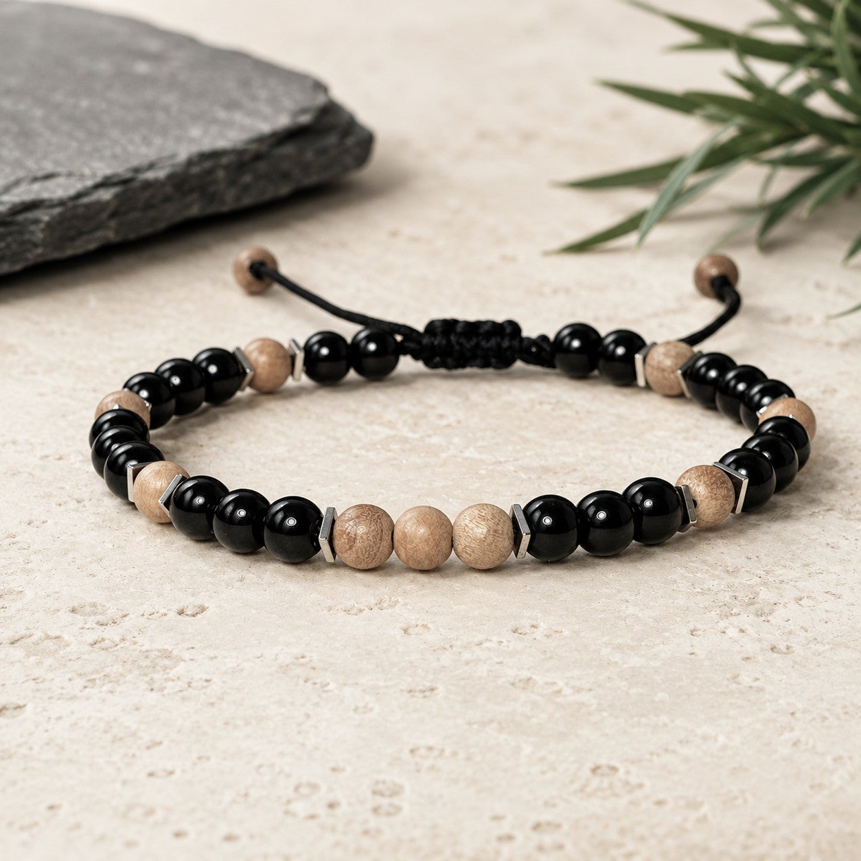 Round beaded Sandalwood Bracelet with black Onyx and a touch of Hematite square flat beads around Sandalwood beads. Round beads are 6mm. Waterproof and easily adjustable with a sliding macrame clasp. Round beads are 6 mm. Great gift for Boyfriend.