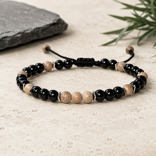 Round beaded Sandalwood Bracelet with black Onyx and a touch of Hematite square flat beads around Sandalwood beads. Round beads are 6mm. Waterproof and easily adjustable with a sliding macrame clasp. Round beads are 6 mm. Great gift for Boyfriend.